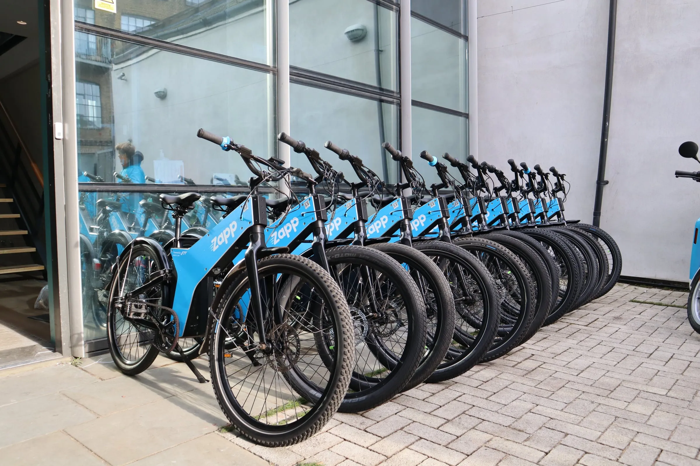 Rows of Zapp-branded ETT fleet bikes